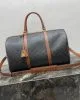 CELINE Medium duffle bag in logo-print calfskin
