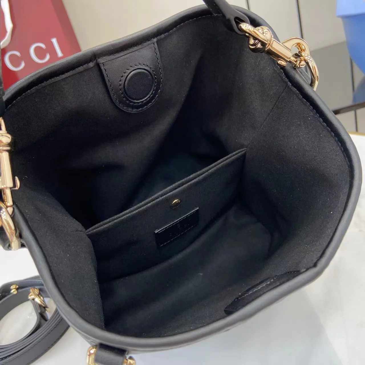 Gucci GG Emblem Small Bucket Bag GG Print Embossed Leather - Black
